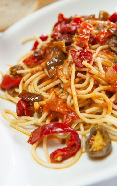 Pasta with sauce and hot sliced peppers